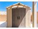 Durable outdoor storage shed with double doors, ideal for storing gardening tools and outdoor equipment at 2612 Tullamore Creek Ln, Laughlin, NV 89029