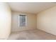 Neutral bedroom with carpet, window, and a simple, clean design for restful nights at 3189 Pinehurst Dr # B, Las Vegas, NV 89109