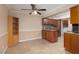 Kitchen with granite countertops, tile floors, stainless steel appliances, and wood cabinetry at 3189 Pinehurst Dr # B, Las Vegas, NV 89109