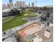 Aerial view of a golf course and pond and the city skyline in the distance at 3207 Bel Air Dr, Las Vegas, NV 89109