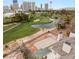 Aerial view showing the property's backyard pool area, with a golf course and the city in the background at 3207 Bel Air Dr, Las Vegas, NV 89109