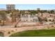 An aerial view shows the backyard pool area near a lushly landscaped golf course with a city view at 3207 Bel Air Dr, Las Vegas, NV 89109