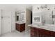 Elegant bathroom with double vanities, marble counters, and ample natural light at 3207 Bel Air Dr, Las Vegas, NV 89109