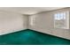 Bright bedroom with large windows and green carpet that offers comfortable living space with natural light at 3207 Bel Air Dr, Las Vegas, NV 89109
