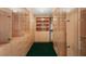 Custom closet with ample shelving, drawers, and glass door storage solutions at 3207 Bel Air Dr, Las Vegas, NV 89109