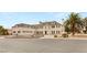 Elegant multi-story home with classic architectural design, three car garage, and meticulously landscaped front yard at 3207 Bel Air Dr, Las Vegas, NV 89109