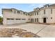 Elegant multi-story home with a three-car garage, a stucco exterior, and a well-manicured front yard at 3207 Bel Air Dr, Las Vegas, NV 89109