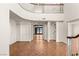 Spacious foyer featuring wood floors, a staircase, and access to multiple rooms at 3207 Bel Air Dr, Las Vegas, NV 89109