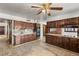 Large kitchen with extensive wooden cabinetry, tile floors, and granite countertops with stainless appliances at 3207 Bel Air Dr, Las Vegas, NV 89109