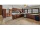 Spacious kitchen featuring wood cabinetry, granite countertops, tile flooring, and stainless steel appliances at 3207 Bel Air Dr, Las Vegas, NV 89109