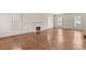Bright living room with hardwood floors, a fireplace, and large windows with white shutters at 3207 Bel Air Dr, Las Vegas, NV 89109
