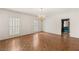 Bright living room with parquet floors, and windows with white shutters at 3207 Bel Air Dr, Las Vegas, NV 89109