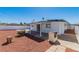 Backyard featuring an outdoor grill, a covered patio, and desert landscaping at 3212 Hickey Ave, North Las Vegas, NV 89030