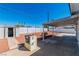 Backyard with an outdoor grill, covered patio and a storage shed at 3212 Hickey Ave, North Las Vegas, NV 89030