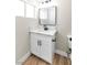 Bathroom featuring a modern vanity with a white countertop and sleek black fixtures at 3212 Hickey Ave, North Las Vegas, NV 89030