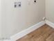 Laundry room featuring water hook-ups and new wood-look flooring at 3212 Hickey Ave, North Las Vegas, NV 89030