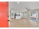 Open concept living room and kitchen area with plenty of natural light and modern appliances at 3212 Hickey Ave, North Las Vegas, NV 89030