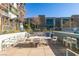 Community BBQ area featuring a full outdoor kitchen, dining table and lush landscaping at 353 E Bonneville Ave # 289, Las Vegas, NV 89101