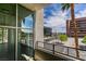 Balcony with open city views through palm trees, and industrial metal railings at 353 E Bonneville Ave # 289, Las Vegas, NV 89101