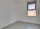 Clean, minimalist bedroom with neutral colors and bright window at 353 E Bonneville Ave # 289, Las Vegas, NV 89101