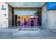 Modern building entrance featuring glass doors and the building name in large lettering at 353 E Bonneville Ave # 289, Las Vegas, NV 89101