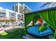 Inviting common area featuring cabana beds, outdoor seating and lush greenery at 353 E Bonneville Ave # 289, Las Vegas, NV 89101