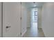 This bright hallway features tiled floors and modern doors at 353 E Bonneville Ave # 289, Las Vegas, NV 89101