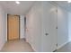 Neutral hallway with light colored walls and modern doors at 353 E Bonneville Ave # 289, Las Vegas, NV 89101