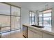 Bright kitchen features modern cabinets and stainless dishwasher at 353 E Bonneville Ave # 289, Las Vegas, NV 89101
