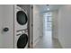Convenient in-unit laundry room with modern stacked washer and dryer at 353 E Bonneville Ave # 289, Las Vegas, NV 89101