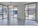 Contemporary living room featuring floor-to-ceiling windows with city views and modern light fixture at 353 E Bonneville Ave # 289, Las Vegas, NV 89101