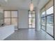 Open-concept living space with large windows and modern lighting fixtures at 353 E Bonneville Ave # 289, Las Vegas, NV 89101