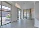 Spacious living area with modern light fixture and large windows offering great city views at 353 E Bonneville Ave # 289, Las Vegas, NV 89101