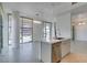 Spacious living room with modern chandelier and large windows at 353 E Bonneville Ave # 289, Las Vegas, NV 89101