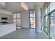 Modern living area with an island, sleek countertops, and ample natural light from large windows at 353 E Bonneville Ave # 289, Las Vegas, NV 89101