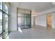 Bright living area with expansive windows, tile floors, and access to the bathroom and balcony at 353 E Bonneville Ave # 289, Las Vegas, NV 89101