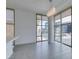 Stylish living area with tile floors, modern lighting, and large windows overlooking the city at 353 E Bonneville Ave # 289, Las Vegas, NV 89101