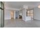 Open living area with tile floors, stainless steel kitchen, and access to bathroom and balcony at 353 E Bonneville Ave # 289, Las Vegas, NV 89101