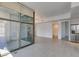 Bright living area featuring tile floors, stainless steel appliances, and sliding glass doors to balcony at 353 E Bonneville Ave # 289, Las Vegas, NV 89101
