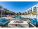Inviting pool area with lounge chairs and a modern fire pit, perfect for outdoor relaxation at 353 E Bonneville Ave # 289, Las Vegas, NV 89101