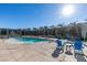 Inviting pool area featuring an in-ground pool, outdoor seating, lush greenery, and a BBQ area at 353 E Bonneville Ave # 289, Las Vegas, NV 89101