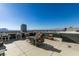 Enjoy city views on this rooftop deck with lounge seating and a dining table at 353 E Bonneville Ave # 289, Las Vegas, NV 89101