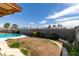Backyard features a brick wall and mature landscaping at 4476 Oakhill Cir, Las Vegas, NV 89121