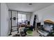 Bedroom with a work desk, multiple monitors, natural light, and a pull-up bar at 4476 Oakhill Cir, Las Vegas, NV 89121