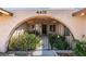 Close up of the front entrance with a decorative gate and lush greenery at 4476 Oakhill Cir, Las Vegas, NV 89121