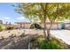Charming home featuring a well-maintained yard and a driveway leading to an attached two-car garage at 4476 Oakhill Cir, Las Vegas, NV 89121