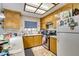 Traditional kitchen featuring light wood cabinets, white countertops, and stainless-steel appliances at 4476 Oakhill Cir, Las Vegas, NV 89121