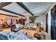 Spacious living room featuring hardwood floors, a large sofa, and exposed beam ceilings at 4476 Oakhill Cir, Las Vegas, NV 89121