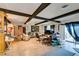 Spacious living room featuring wood beams, hardwood floors, and an open design at 4476 Oakhill Cir, Las Vegas, NV 89121