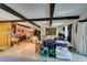 Open living area boasting wood beams, hardwood floors, and lots of natural light at 4476 Oakhill Cir, Las Vegas, NV 89121